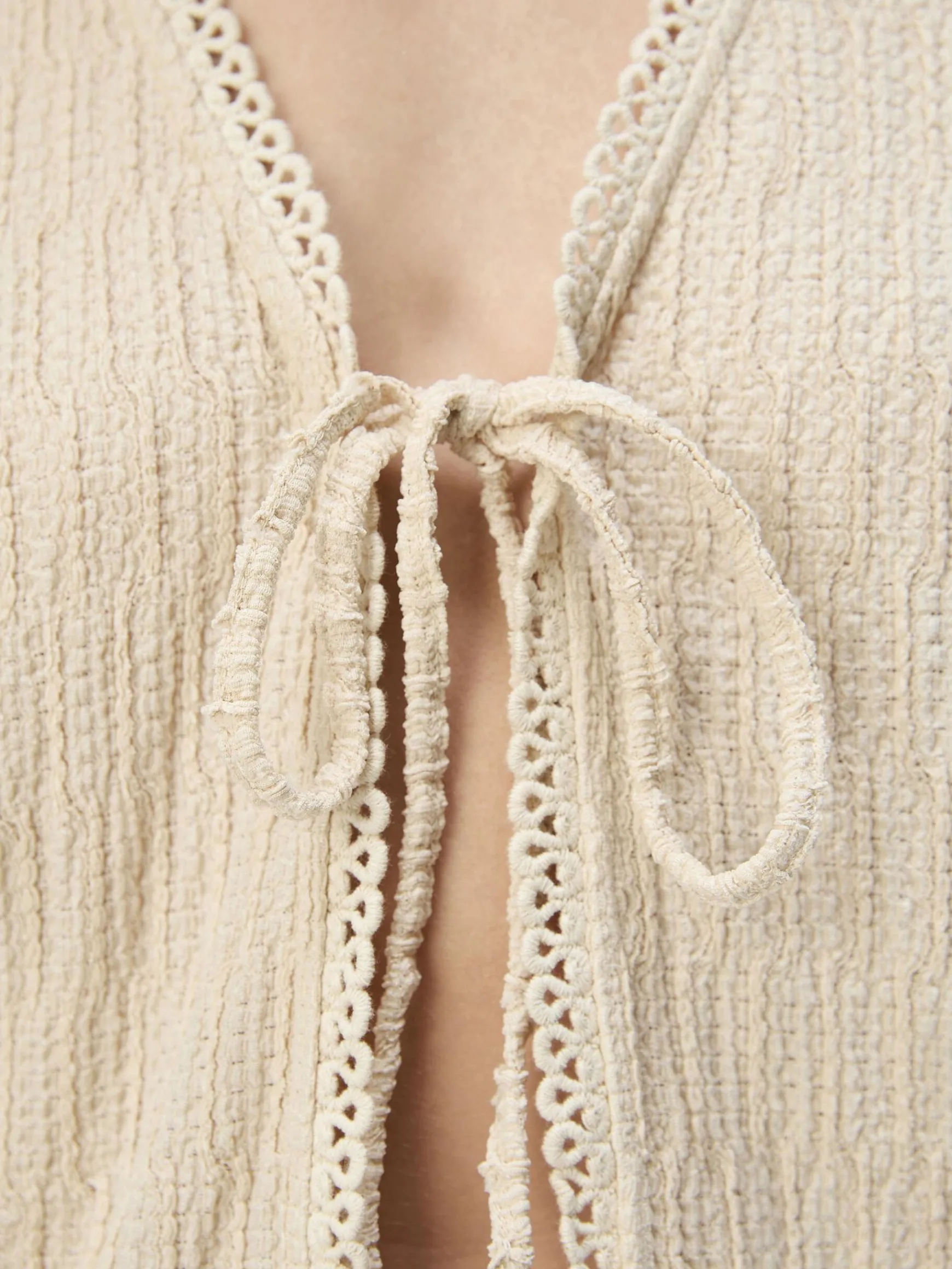 Dame OBJECT BINDELUKNING FORAN TOP